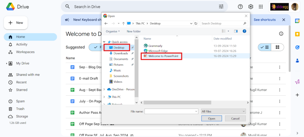 Selecting ‘Welcome to PowerPoint’ file from the desktop folder in an open file dialog box with Google Drive in the background.