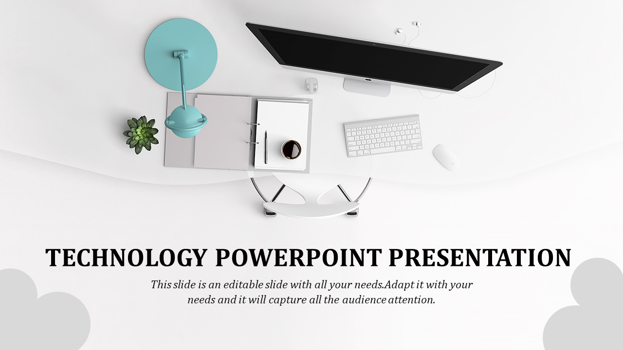 Flat lay of an organized workspace including a monitor, keyboard, lamp, notebook, and green plant for a technology.