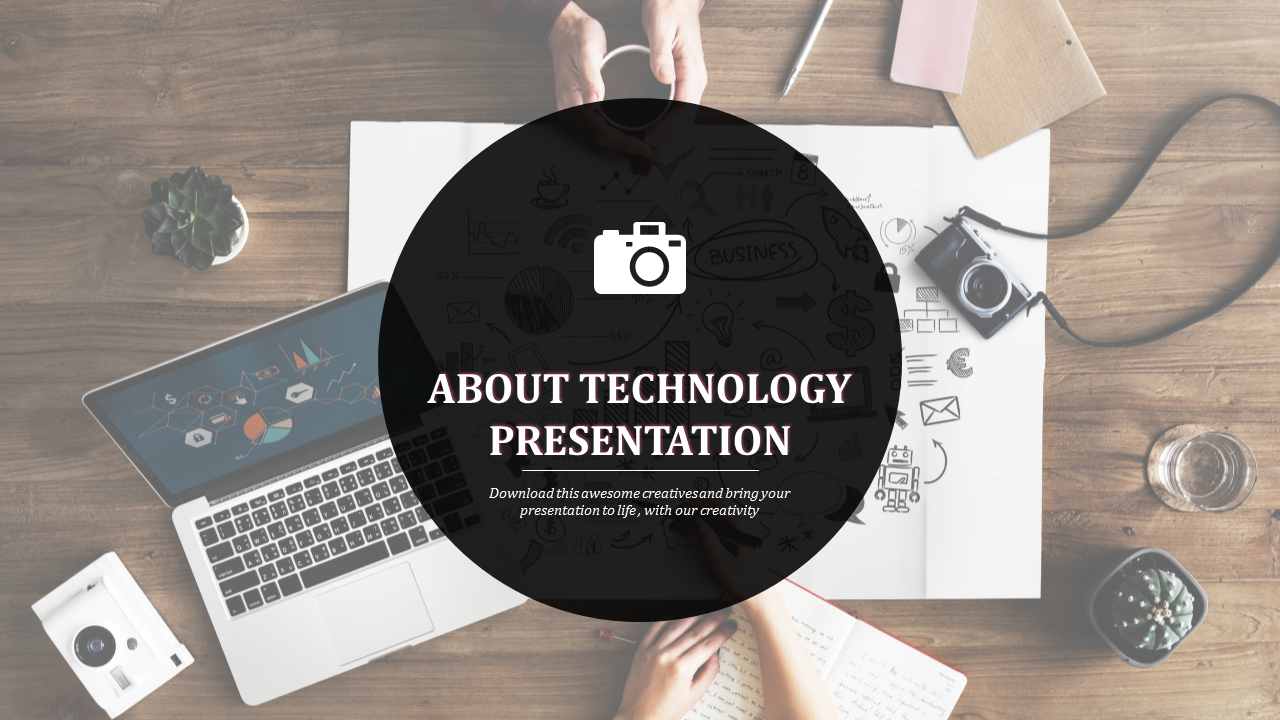 Technology slide with a black circle overlay, featuring a laptop, camera, notebook, and potted plants on a wooden desk.