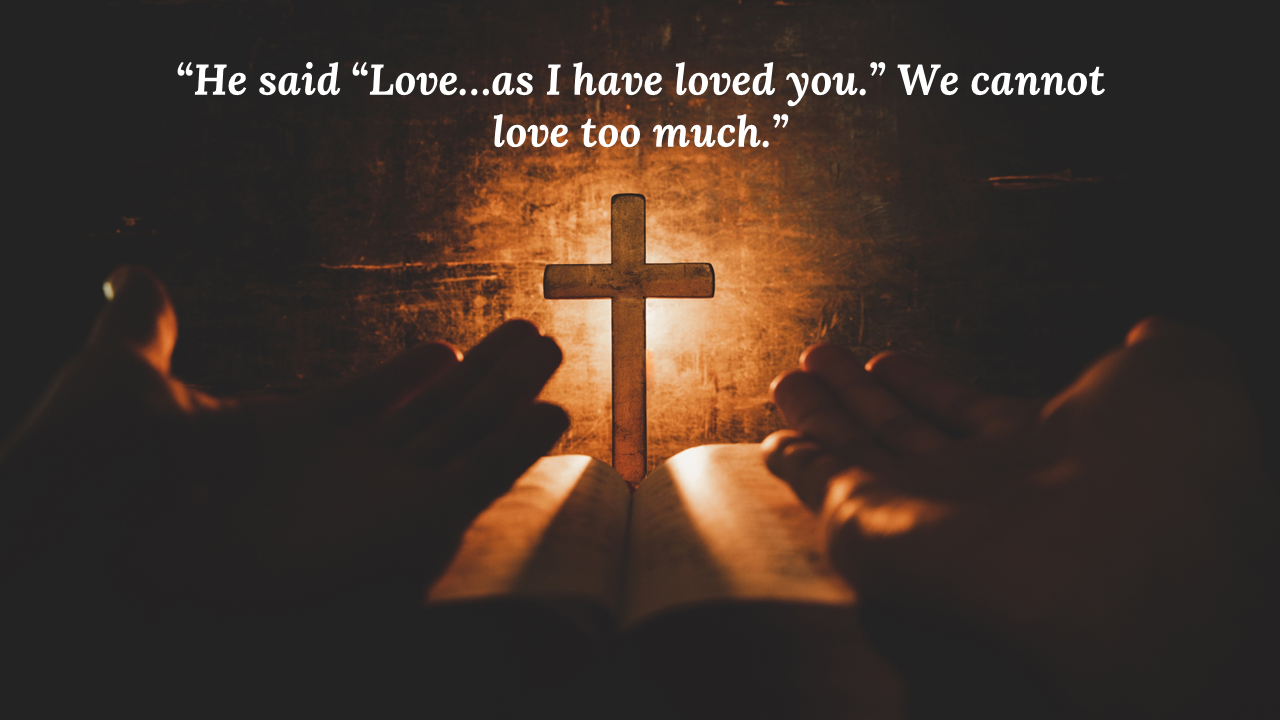 Silhouette of praying hands in front of a cross illuminated by light, symbolizing faith and love on a dark backdrop.