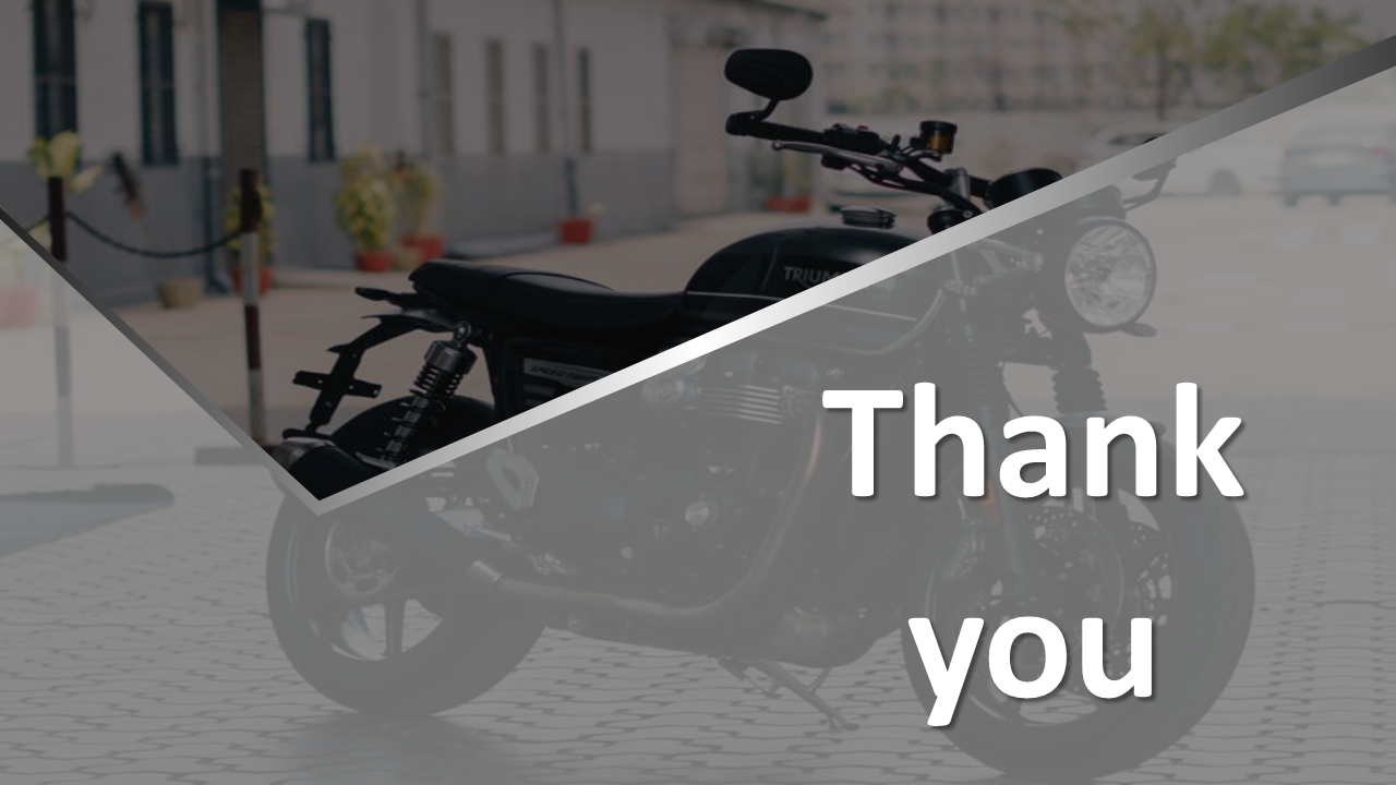 Thank you slide with a stylish motorcycle in the background, emphasizing gratitude at the end of a presentation.