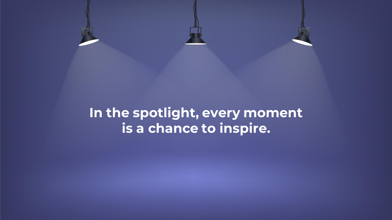 A dark blue PowerPoint background with spotlight beams shining down, with the inspirational quote.