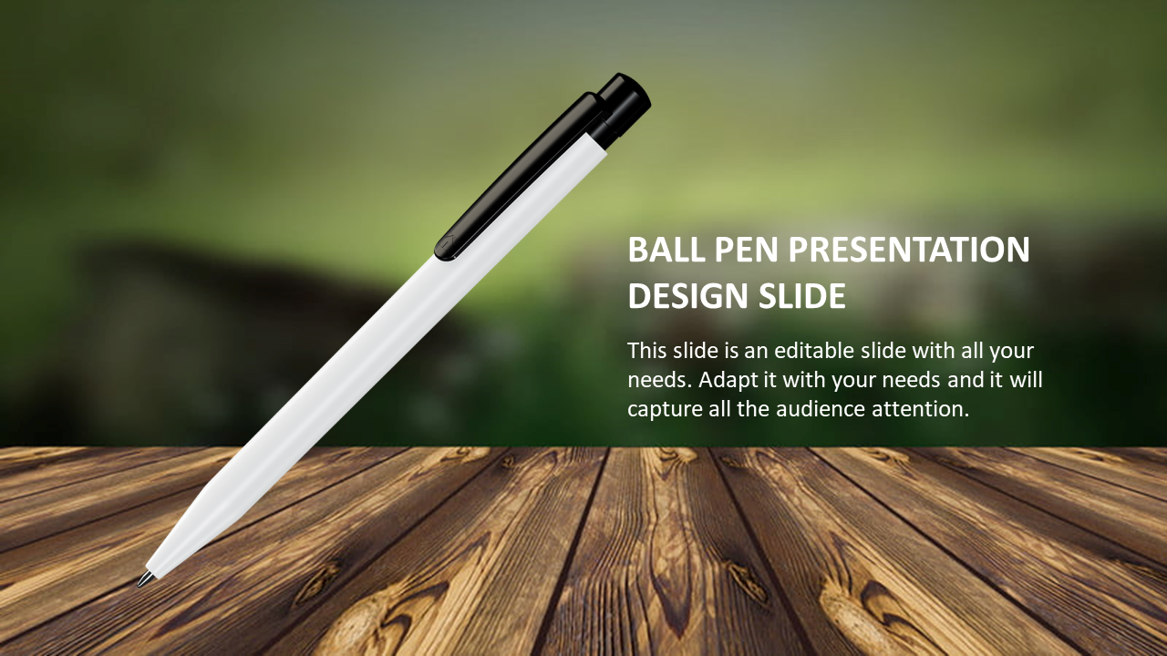 A white pen with a black clip placed diagonally on a wooden surface, against a blurred green background.