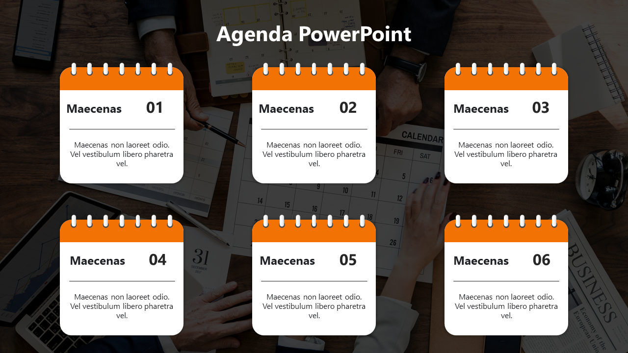 Six numbered calendar style boxes with orange headers arranged in two rows, against a background of a desk.