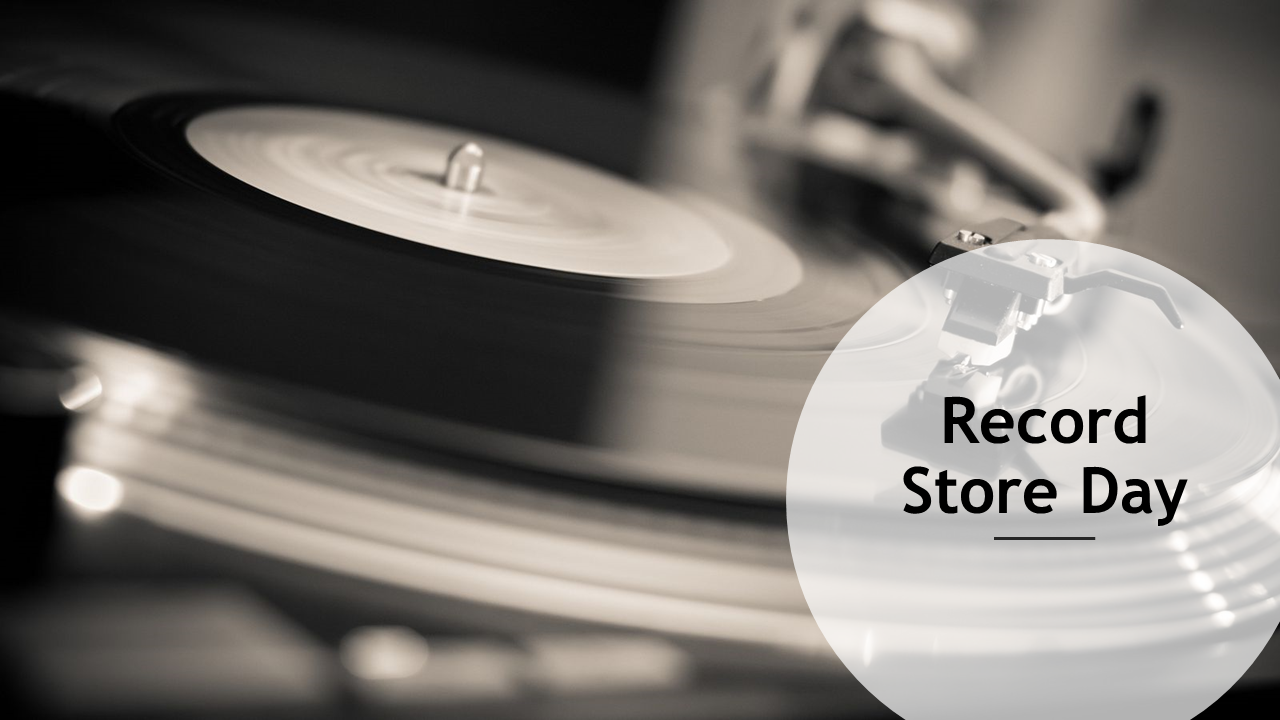 Turntable playing a vinyl record in black and white, with a transparent circle containing text.