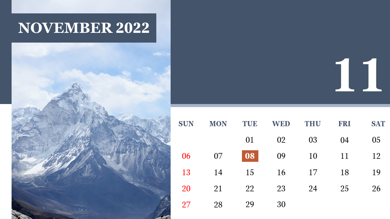 November 2022 calendar with a snowy mountain backdrop, featuring a clean grid layout with a highlighted date in orange.