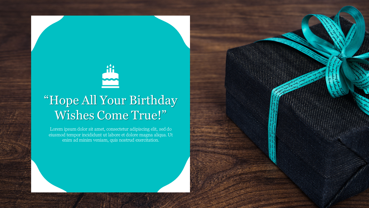 Teal themed birthday card with a cake illustration and a message, set against a gift box with a ribbon, on a wooden surface.