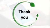 Thank you slide with modern green leaf design with text area and a subtle image of a hand holding a phone in the background.