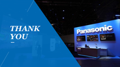 Panasonic booth with illuminated signage and a blue triangular overlay with text on the left.